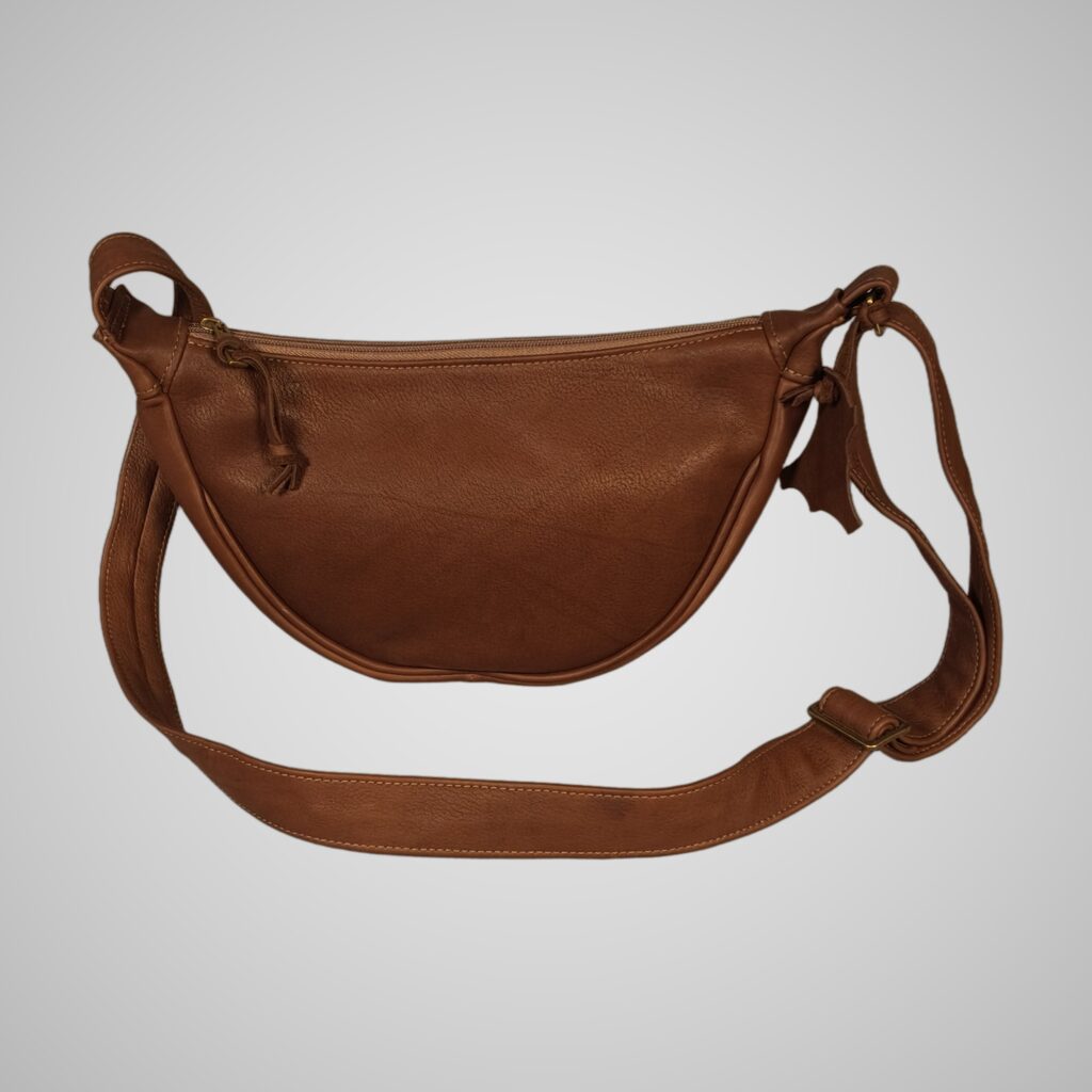 Front view of Lumengin Half Moon cross-body bag in brown Charles F. Stead suede on soft grey