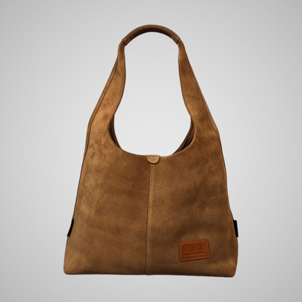 Front view of Lumengin XL slouchy hobo bag in sand calf suede on soft grey