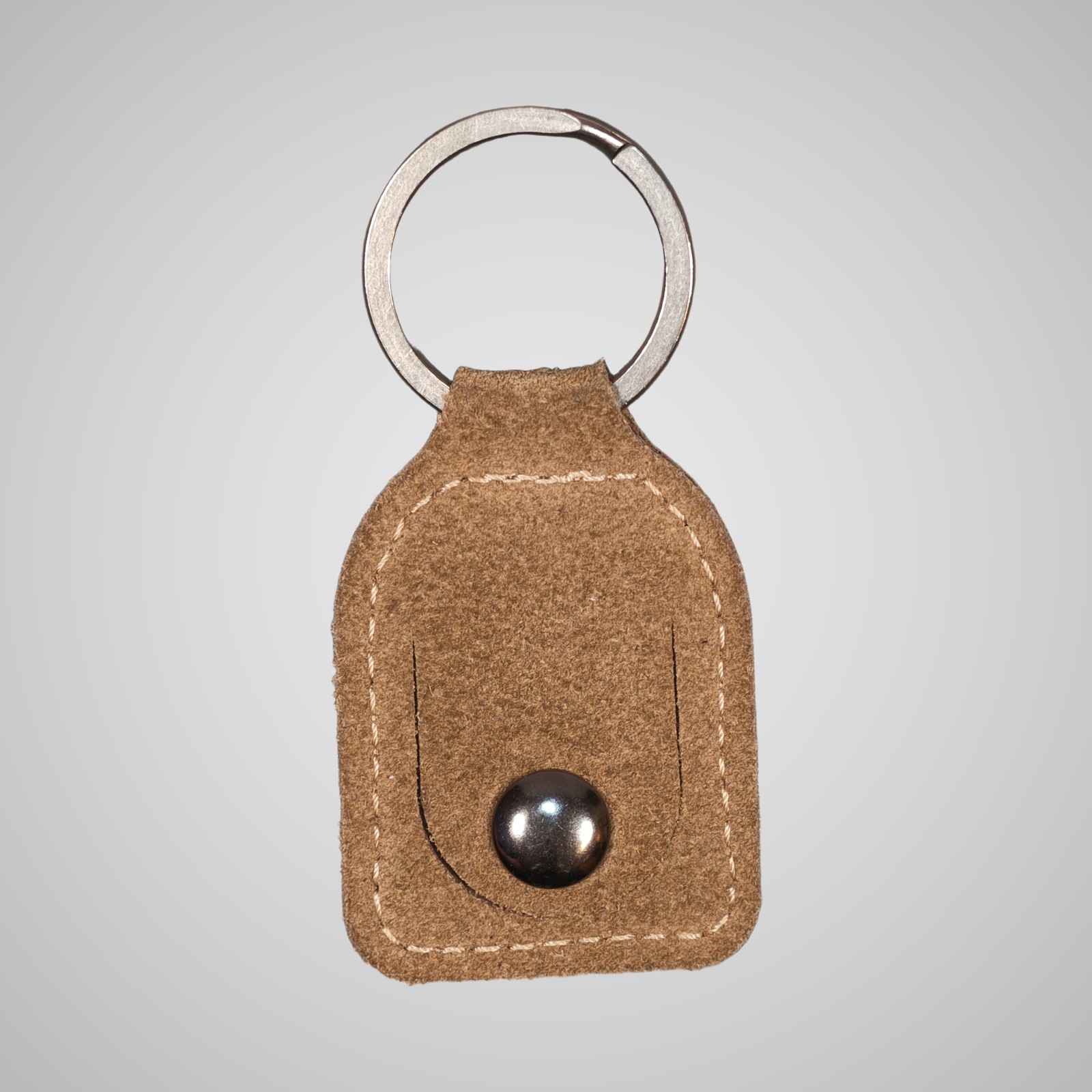 Lumengin sand calf suede £1 coin holder keyring, front view on soft grey background