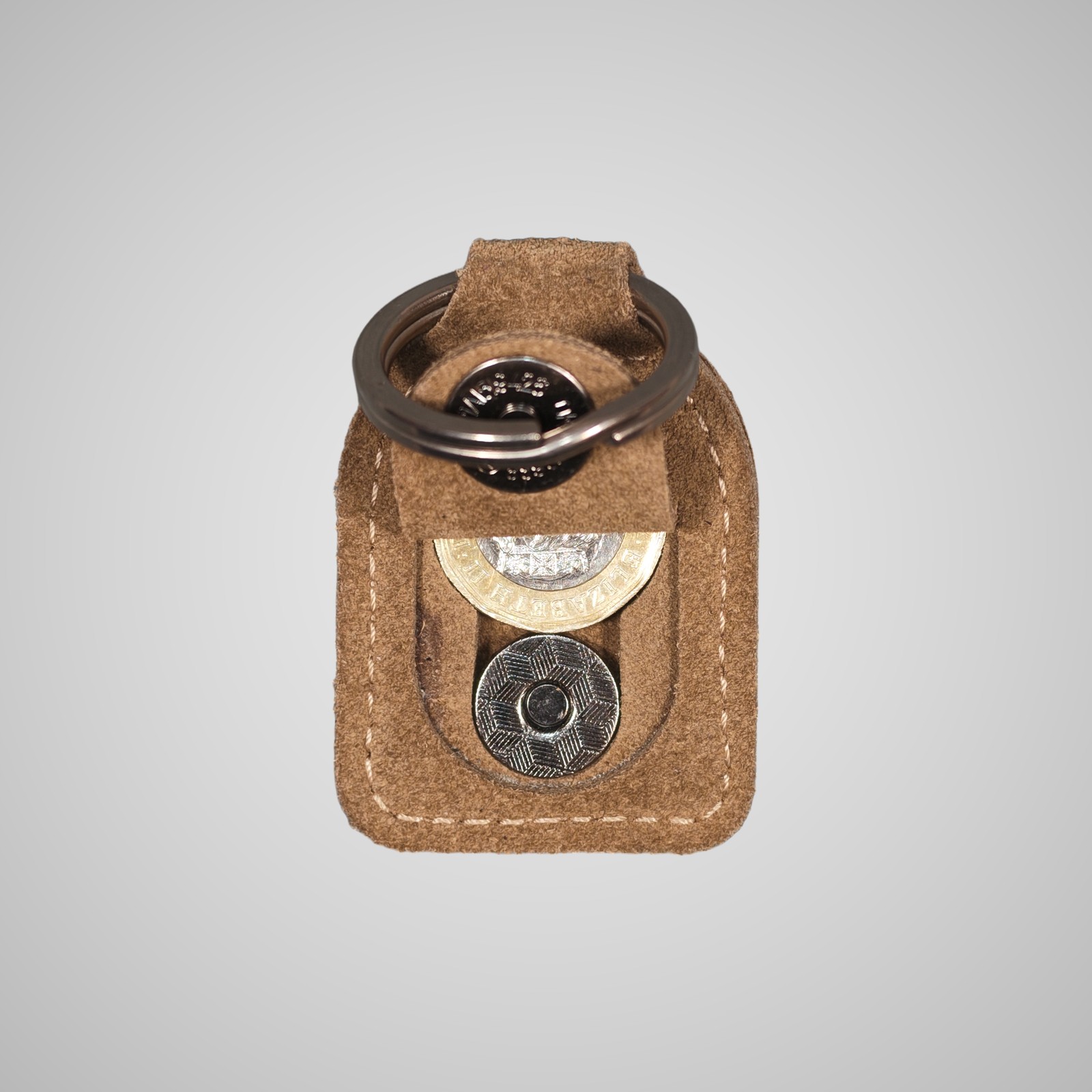 Lumengin sand calf suede £1 coin holder keyring, opened, holding a £1 coin, on soft grey background