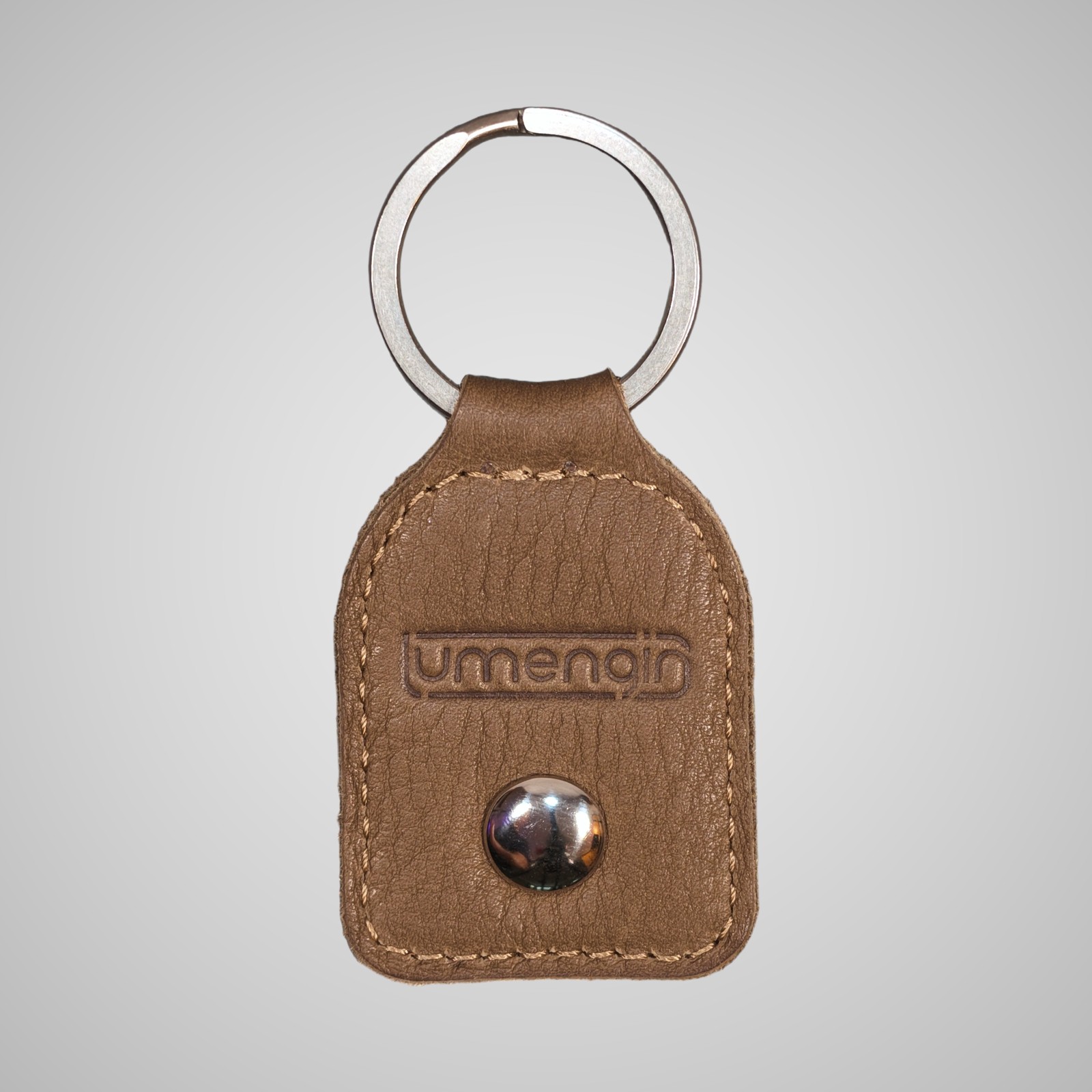 Lumengin green/gold Janus calf £1 coin holder keyring, embossed lumengin logo side on soft grey background