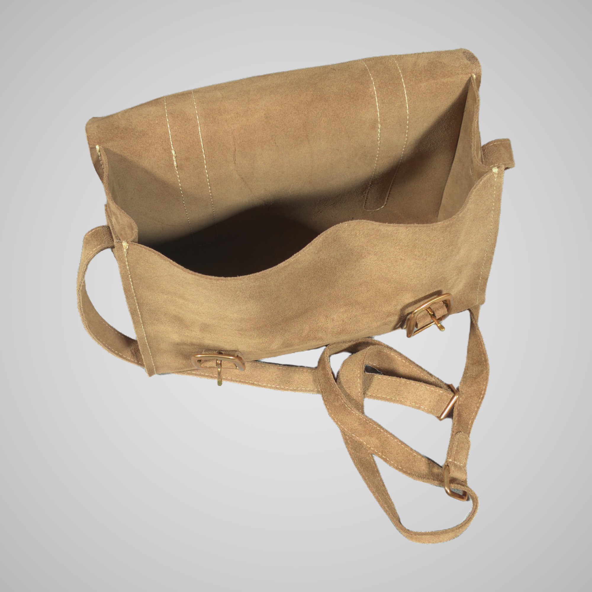 Inside the unlined Lumengin Sand calf suede cross-body bag, with the flap open, on soft grey